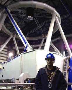 John Antoniadis in front of an 8.2m- VLT telescope of ESO, the European southern Observatory. The component masses of the pulsar-white dwarf binary system PSR J0348+0432 were determined with the VLT telescopes.