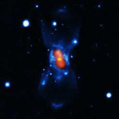 This picture shows the remains of the new star that was seen in the year 1670. It was created from a combination of visible-light images from the Gemini telescope (blue), a submillimetre map showing the dust from the SMA (yellow) and finally a map of the molecular emission from APEX and the SMA (red).