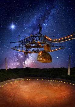 The 305-metre Arecibo telescope, in Puerto Rico, and its suspended support platform of radio receivers is shown amid a starry night. A flash from the Fast Radio Burst source FRB 121102 is indicated, originating from deep in extragalactic space.