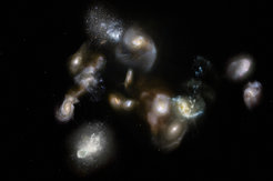 Artist’s impression of of the actual configuration of galaxies in SPT 2349. Such mergers have been spotted using the ALMA and APEX telescopes and represent the formation of galaxies clusters, the most massive objects in the modern Universe.