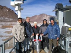 4th of September 2006, the day of the first installation: the LABOCA team at the APEX telescope. Left to right: N. Jethava, W. Esch, G. Lundershausen, G. Siringo and E. Kreysa. In the middle: the LABOCA cryostat - ready for installation.