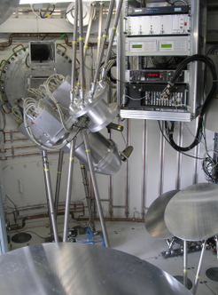 Dewar, imaging mirrors, and the electronics rack as mounted in the APEX Cassegrain cabin.