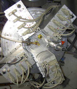 Top view of the cryostat: The four amplification units with their cabling are shown.
