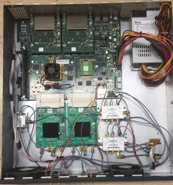 An image of the ROACH2 board in a modified chassis to support RF switches, a clock module and better thermal management. Four such ROACH2 boards are used int he PSRIX2 instrument