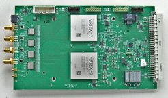 Photo of the final qFFTS4G spectrometer board. The qFFTS4G enables spectroscopic signal analysis of 4 × 4 GHz in 4 × 64k channels. It is able to directly sample baseband signals (0-4 GHz), but also IF signals in the range 4-8 GHz. Thanks to a newly developed 1 Gbit/s Ethernet interface based on a Xilinx Zynq7 FPGA with ARM microprocessor, spectra can be transmitted with full channel count at up to 50 Hz.