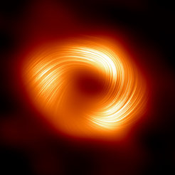 Fig. 1: The Event Horizon Telescope (EHT) collaboration, who produced the first ever image of our Milky Way black hole released in 2022, has captured a new view of the massive object at the center of our Galaxy: how it looks in polarized light. This is the first time that astronomers have been able to measure polarization, a signature of magnetic fields, this close to the edge of Sagittarius A*. This image shows the polarized view of the Milky Way black hole. The lines mark the orientation of polarization, which is related to the magnetic field around the shadow of the black hole.